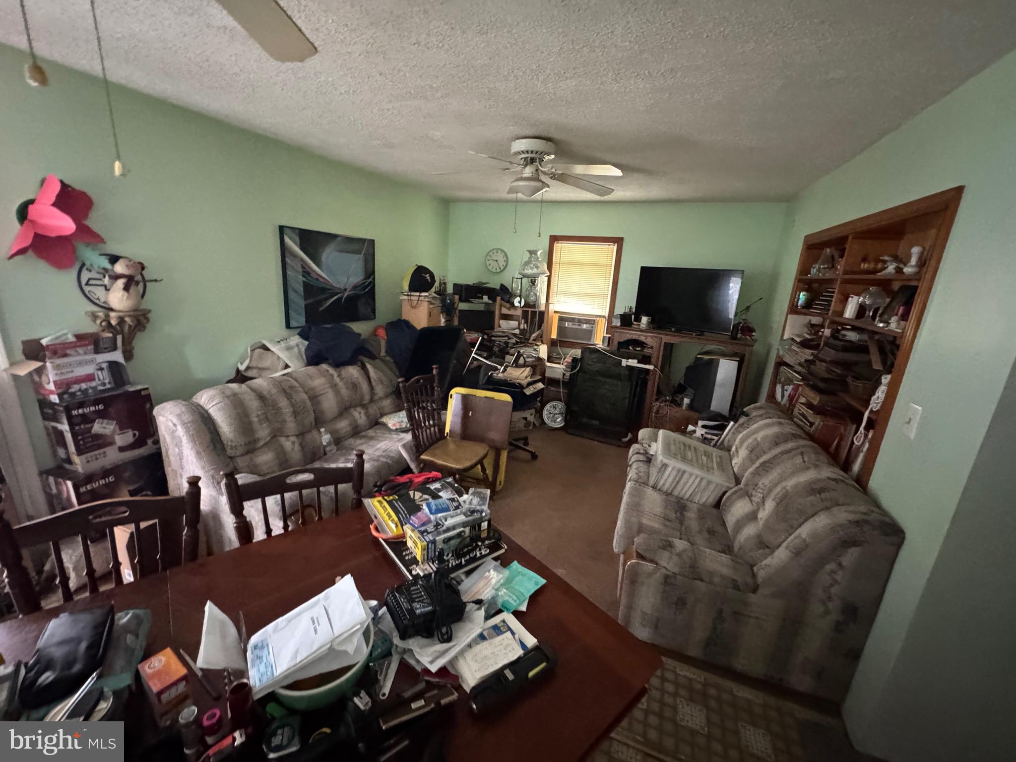 200 West Buckshutem Road Millville, NJ 08332 - Photo 6 of 10 a living room with furniture a rug and a window