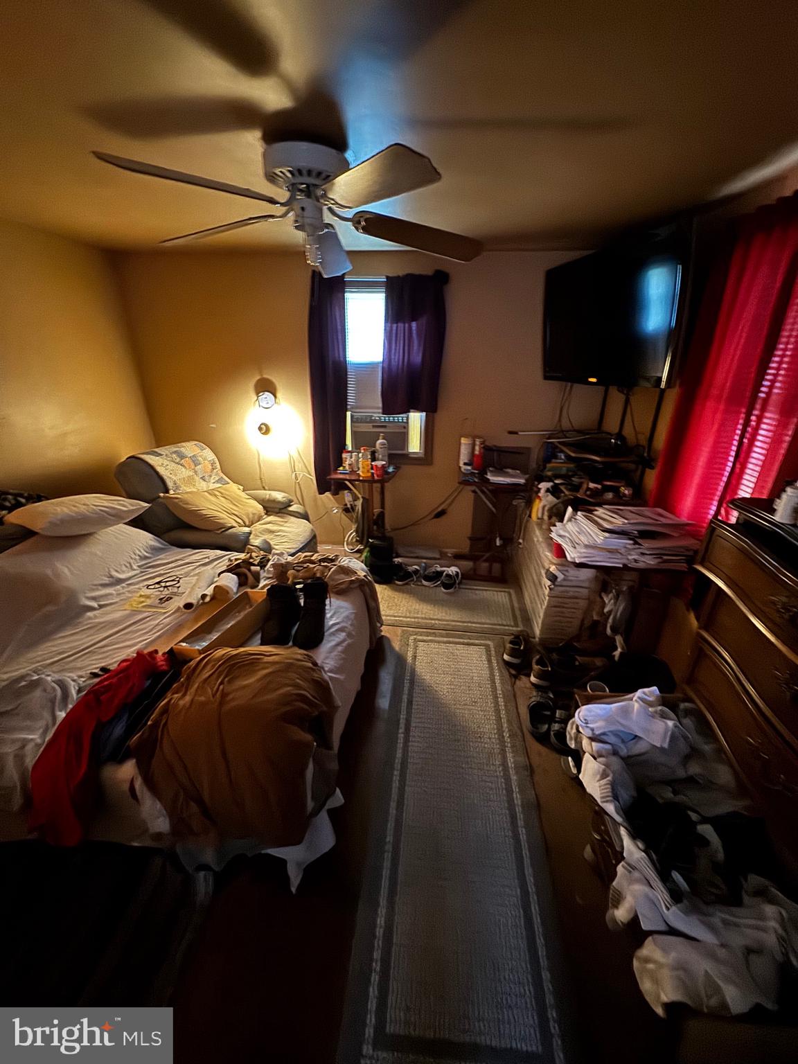 200 West Buckshutem Road Millville, NJ 08332 - Photo 9 of 10 a bed room with a bed and a television