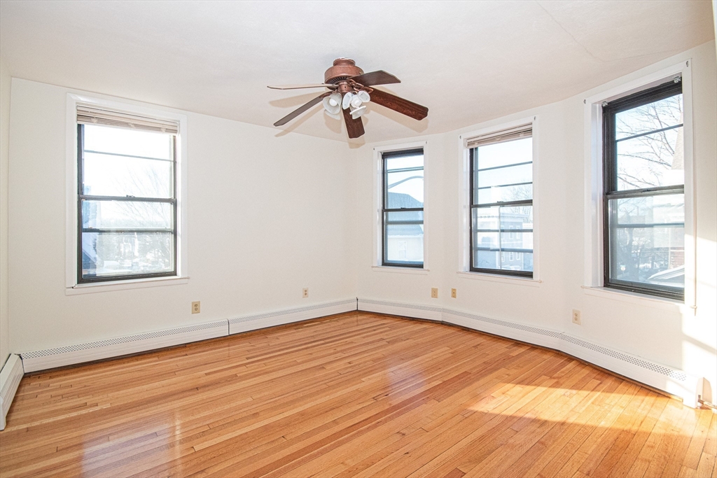 29 William Street, Unit 22 Worcester, MA 01609 - Photo 13 of 14 a view of empty room with wooden floor and fan