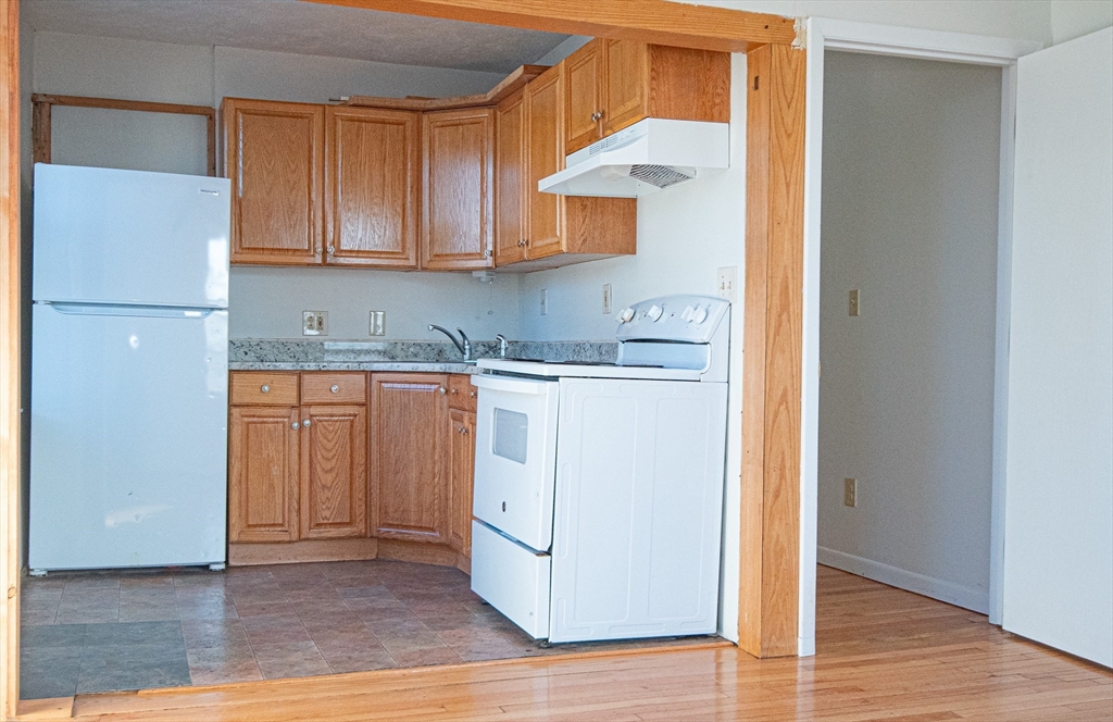 29 William Street, Unit 22 Worcester, MA 01609 - Photo 2 of 14 a kitchen with a sink a cabinetry and cabinets