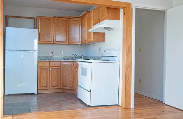 a kitchen with a sink a cabinetry and cabinets