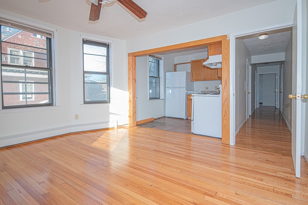 29 William Street, Unit 22 Worcester, MA 01609 - Photo 5 of 14 wooden floor in an empty room with a window