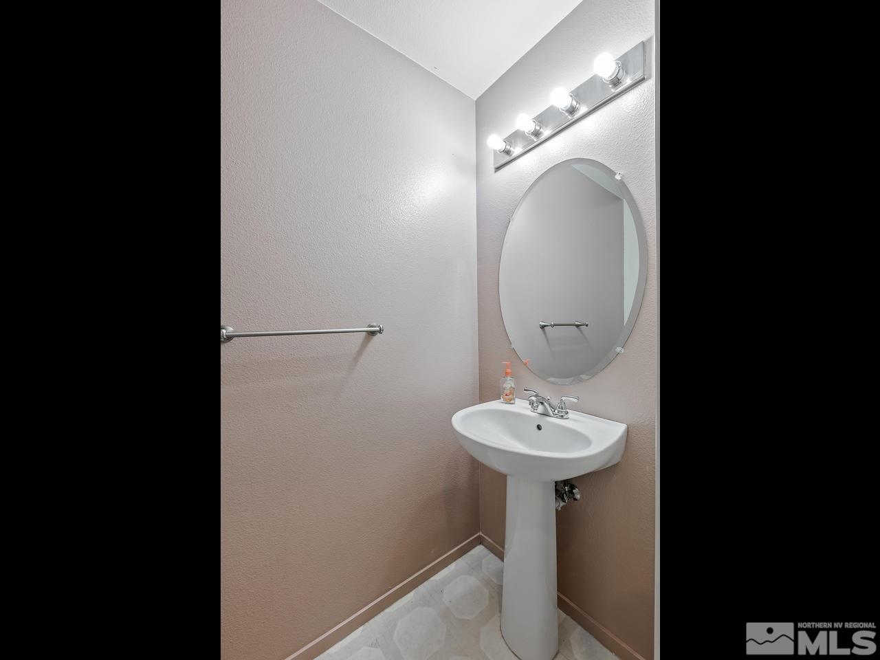 1287 Tule Drive Reno, NV 89521 - Photo 15 of 32 a bathroom with a sink and a mirror