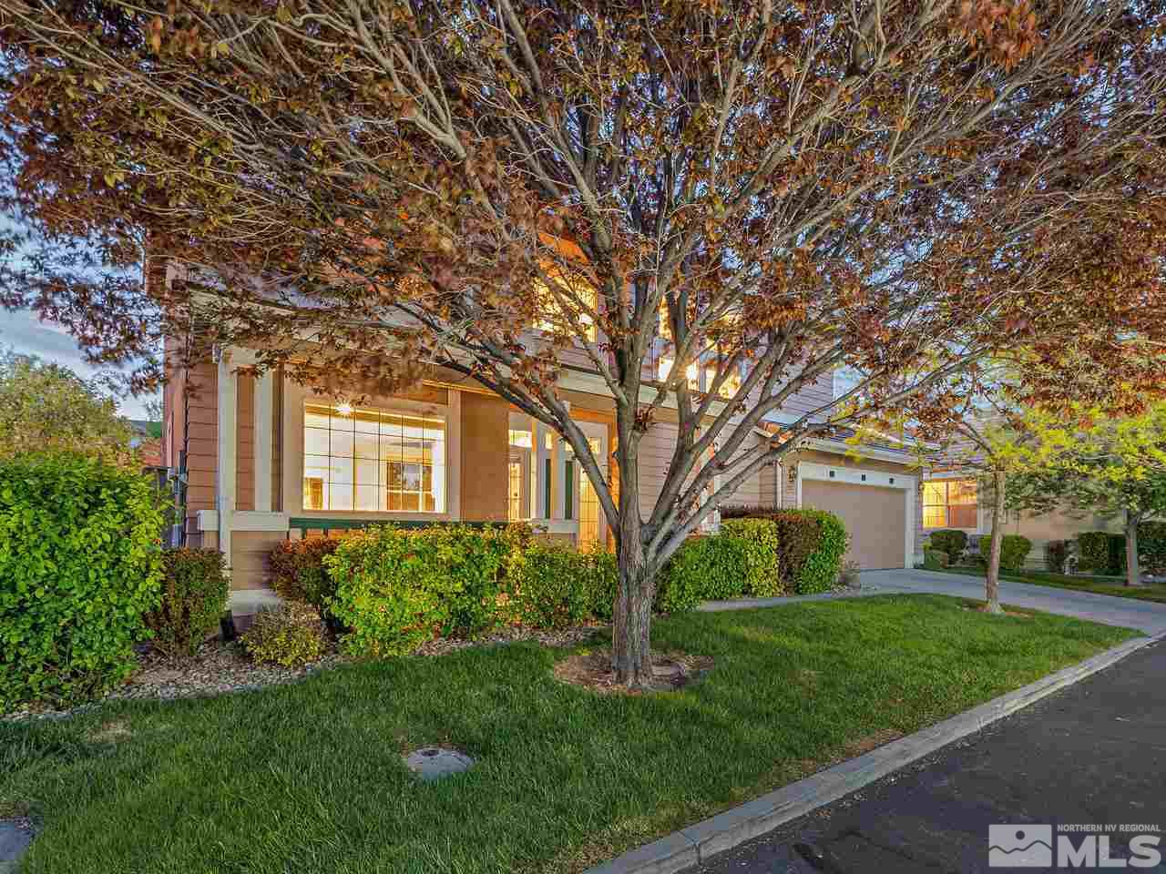 1287 Tule Drive Reno, NV 89521 - Photo 2 of 32 a front view of a house with a garden