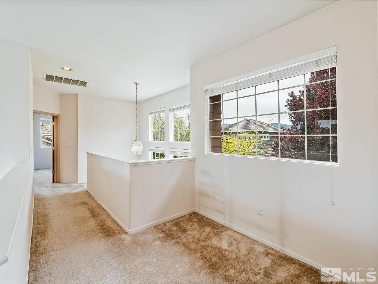 1287 Tule Drive Reno, NV 89521 - Photo 21 of 32 a view of a kitchen with furniture and windows