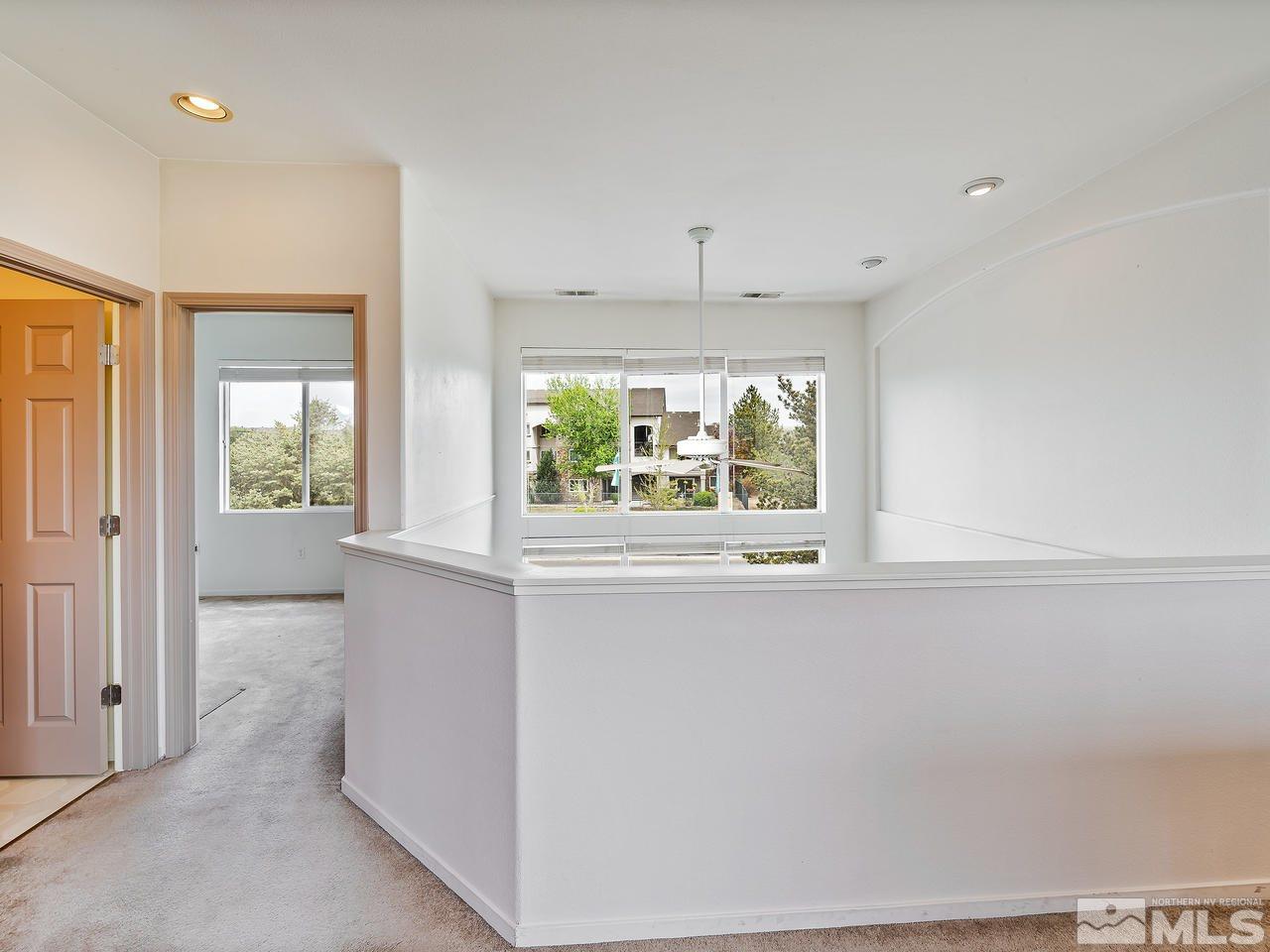 1287 Tule Drive Reno, NV 89521 - Photo 22 of 32 wooden floor in an empty room with a window