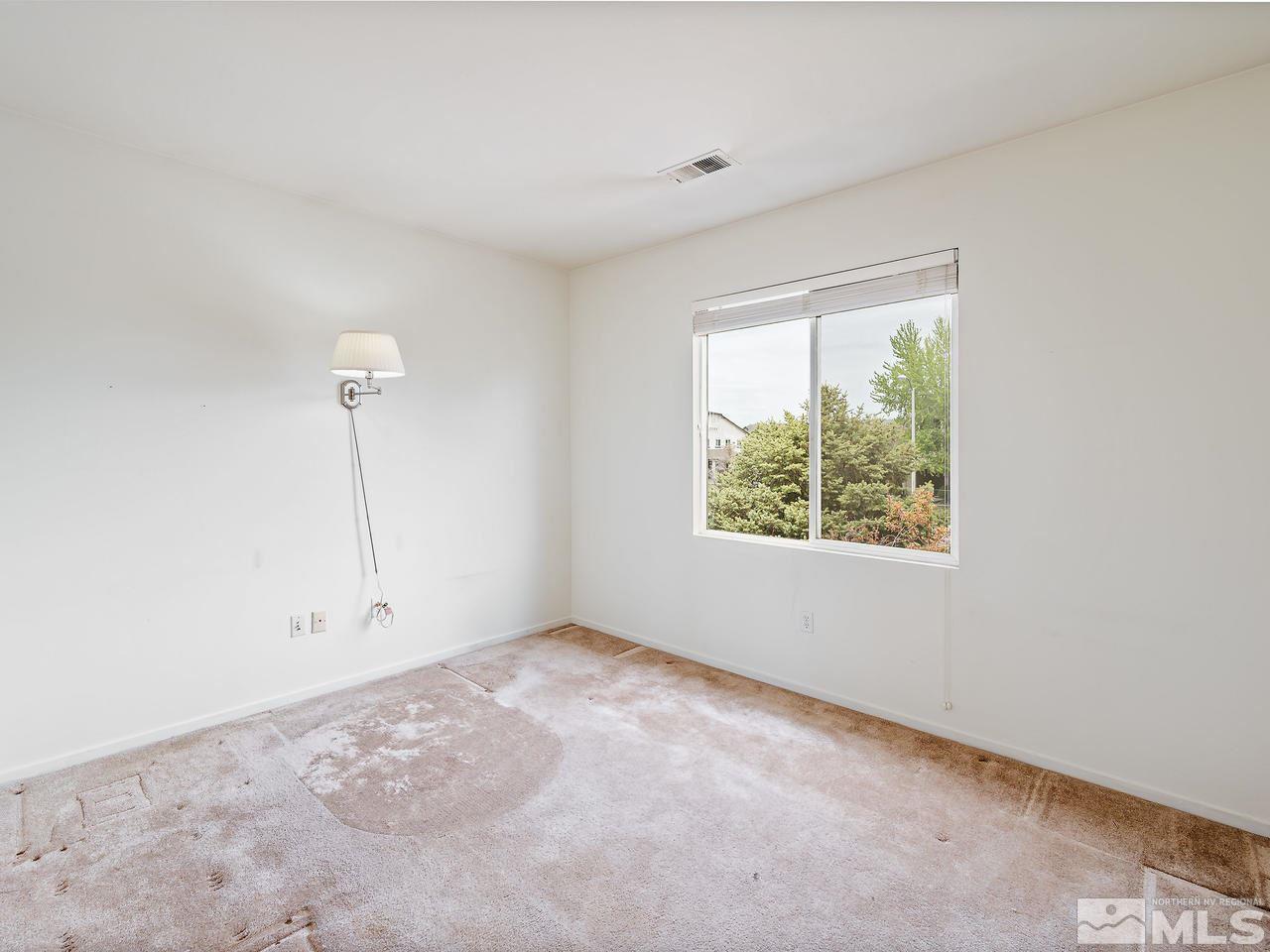 1287 Tule Drive Reno, NV 89521 - Photo 23 of 32 a view of an empty room with a window