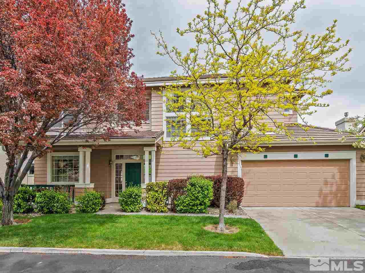 1287 Tule Drive Reno, NV 89521 - Photo 3 of 32 a front view of a house with a garden and yard