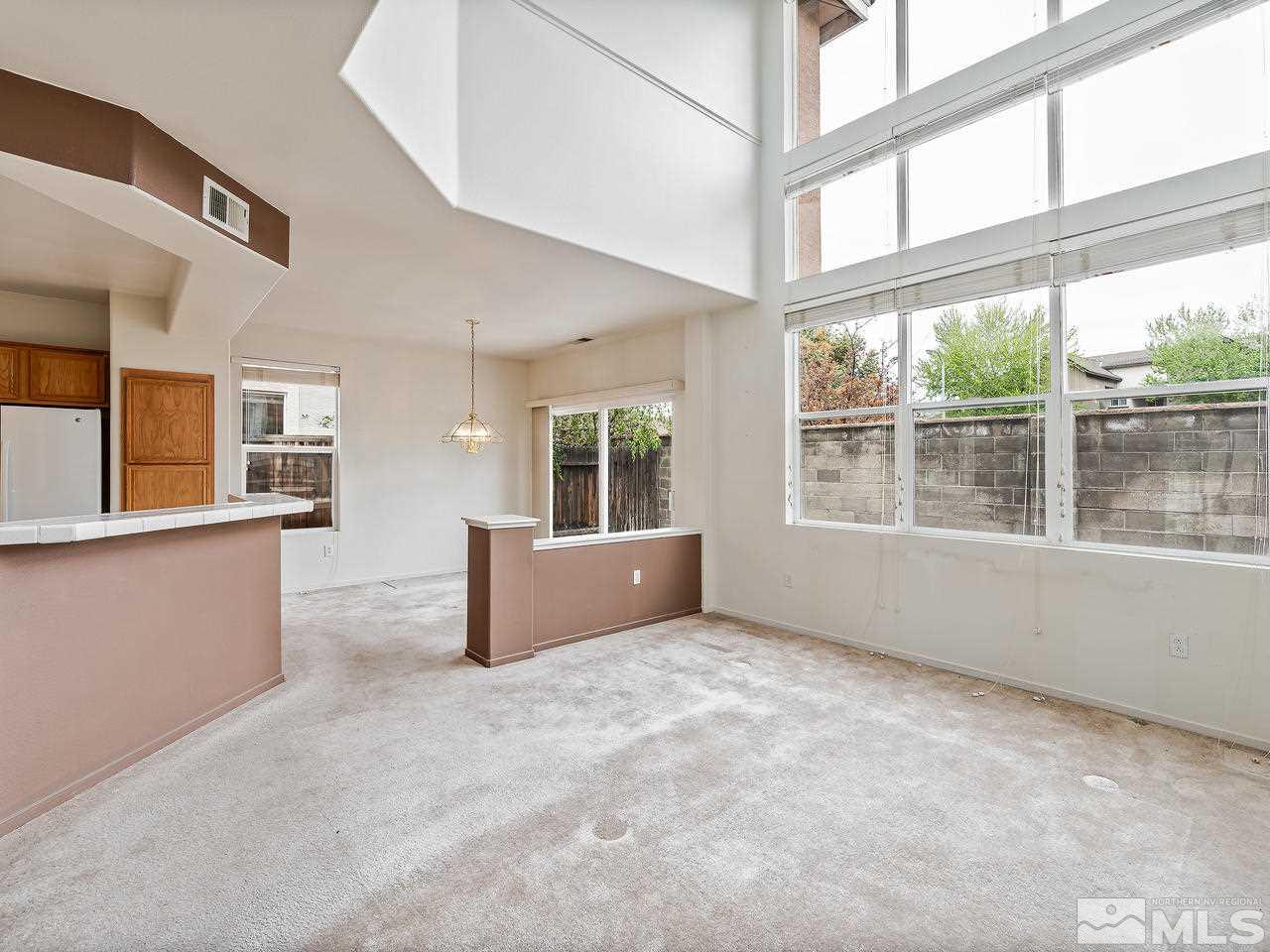 1287 Tule Drive Reno, NV 89521 - Photo 6 of 32 a view of an empty room with a window