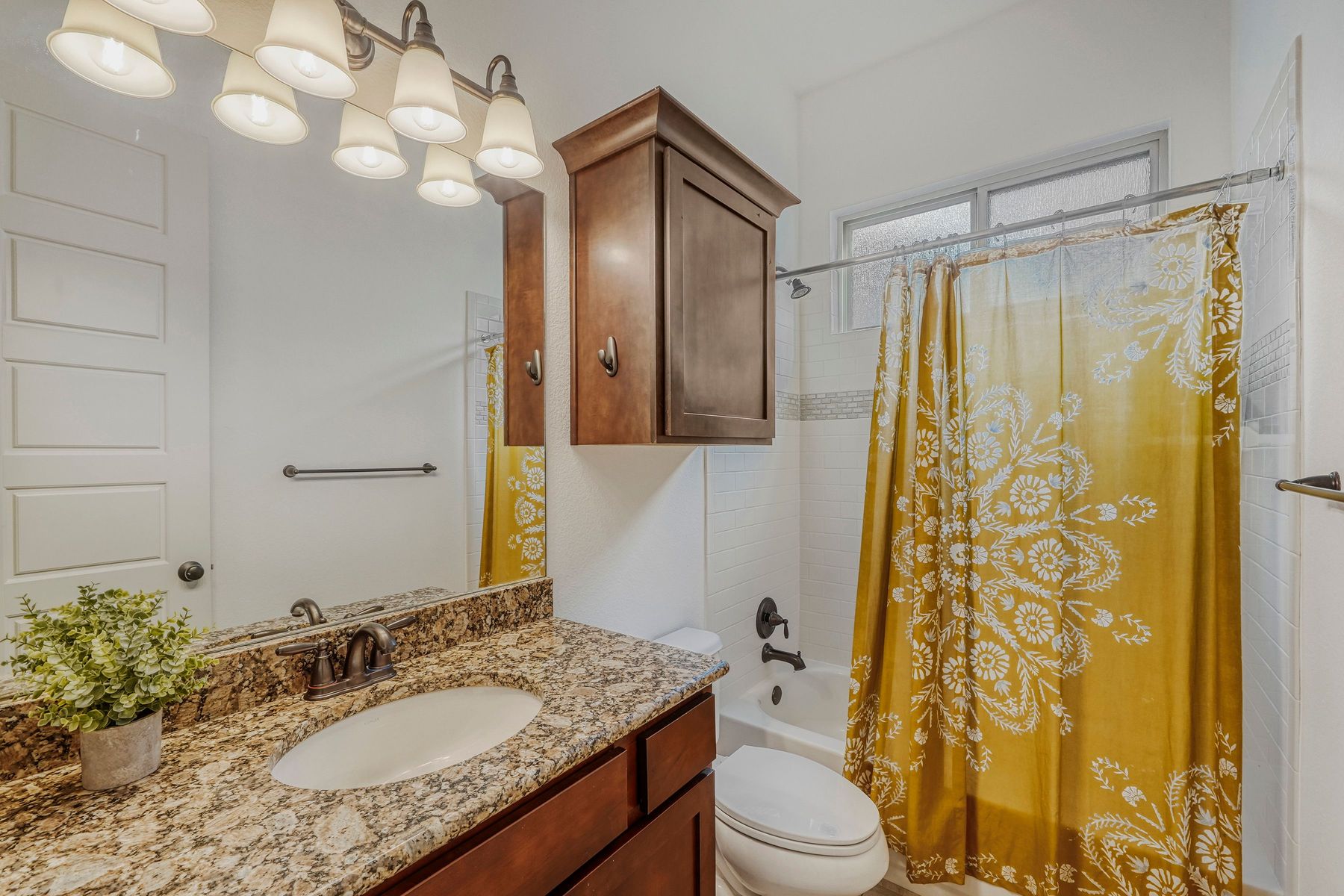 2913 Chisholm Trail Austin, TX 78734 - Photo 13 of 24 a bathroom with a granite countertop sink toilet and shower