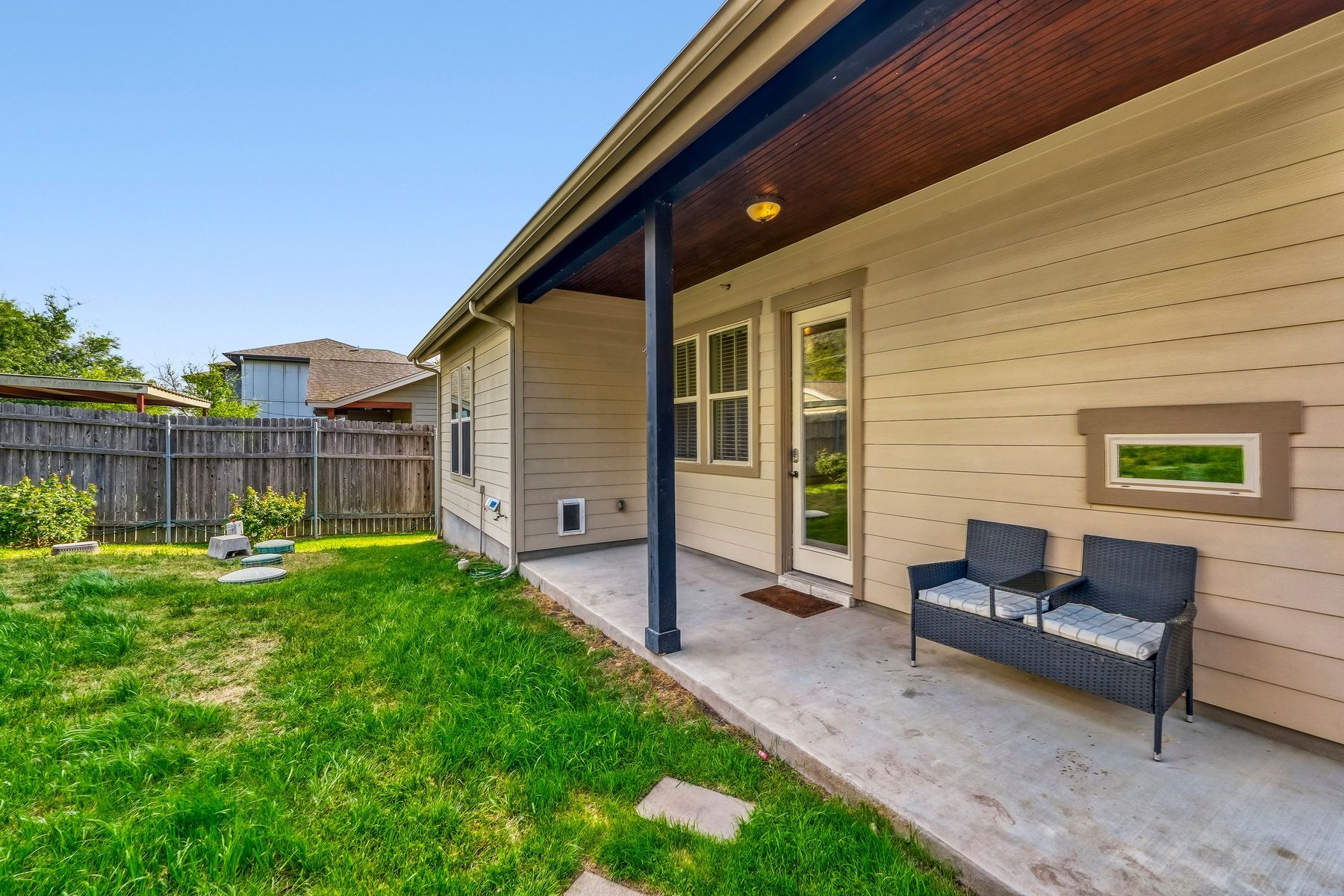 2913 Chisholm Trail Austin, TX 78734 - Photo 17 of 24 a view of a backyard with couches plants and wooden fence