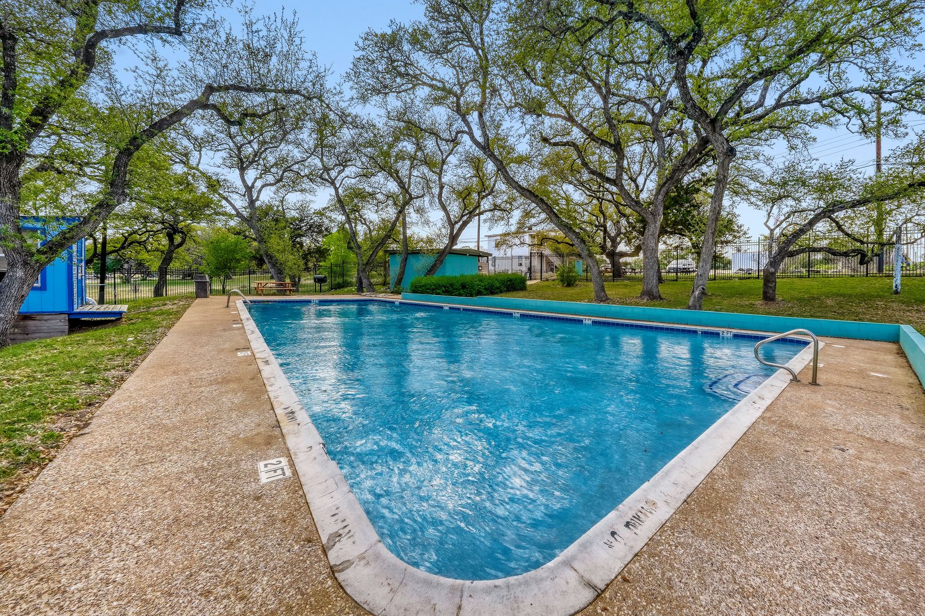 2913 Chisholm Trail Austin, TX 78734 - Photo 21 of 24 a view of a swimming pool with a yard