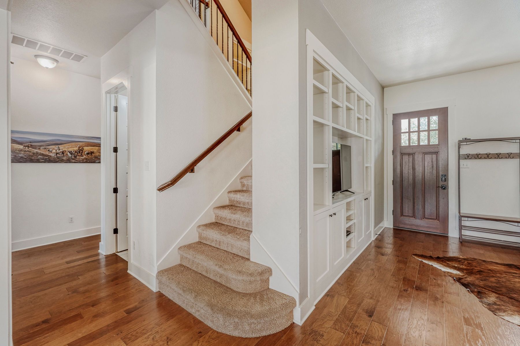 2913 Chisholm Trail Austin, TX 78734 - Photo 7 of 24 a view of entryway with wooden floor and stairs