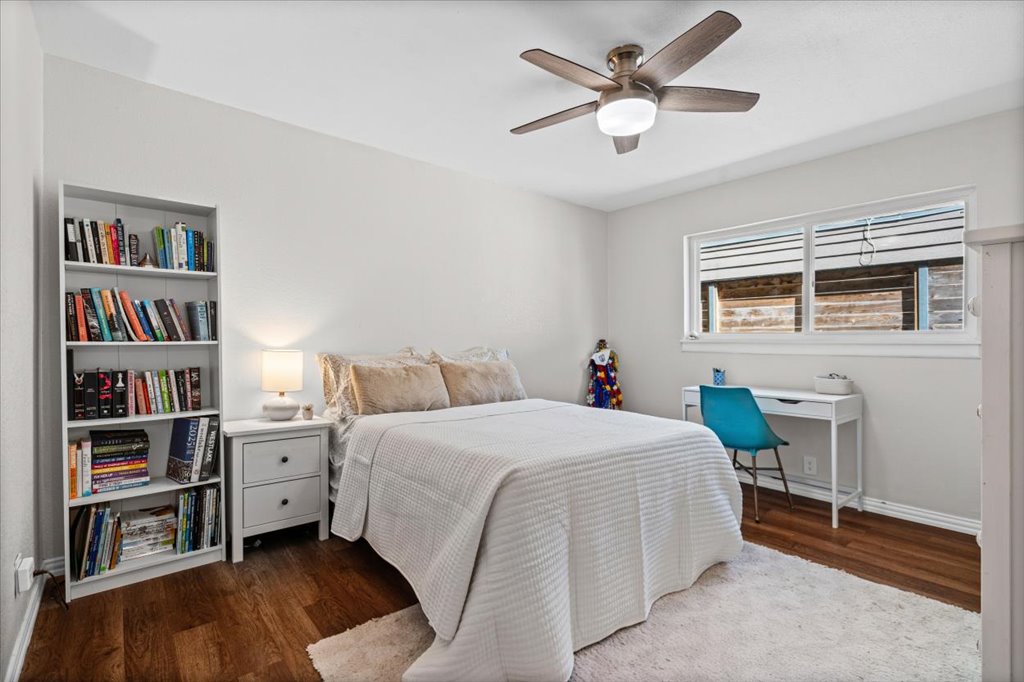 2208 Enfield Road, Unit 107 Austin, TX 78703 - Photo 24 of 35 a bedroom with a bed and a book shelf