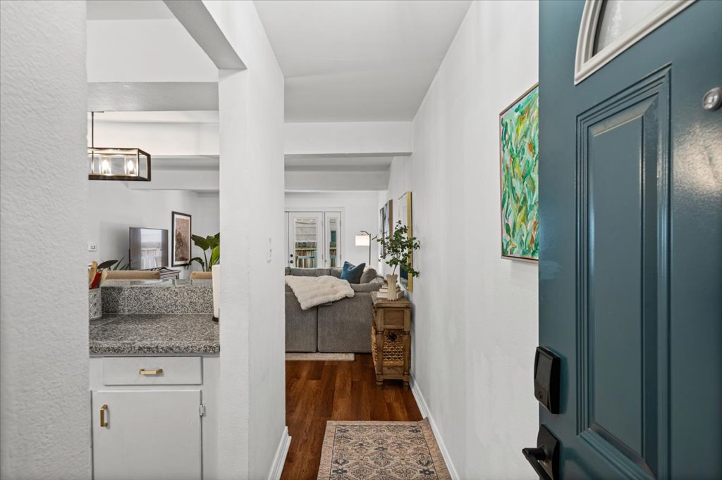 2208 Enfield Road, Unit 107 Austin, TX 78703 - Photo 5 of 35 a view of living room with furniture and wooden floor