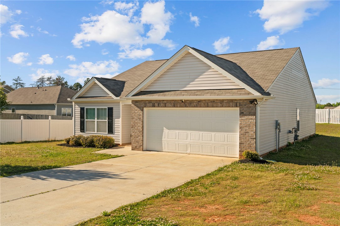 205 Hillendale Way Pelzer, SC 29669 - Photo 3 of 29 This charming home offers convenient living with a classic exterior and a well-maintained yard.