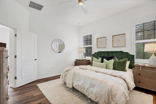 a bedroom with bed and a window