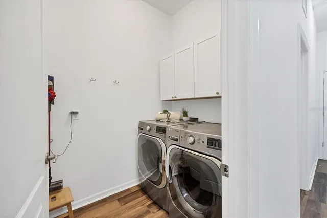 a view of a storage & utility room with washer and dryer