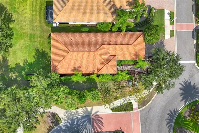 an aerial view of a house with a garden and yard