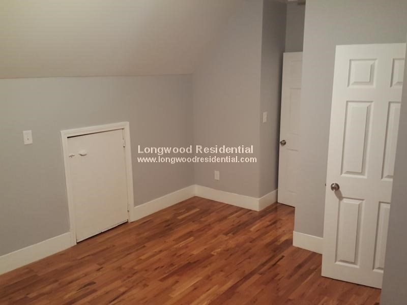 39 Pinckney Street, Unit 3 Somerville, MA 02145 - Photo 12 of 17 a view of a room with wooden floor