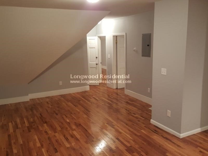 39 Pinckney Street, Unit 3 Somerville, MA 02145 - Photo 3 of 17 a view of a livingroom with wooden floor