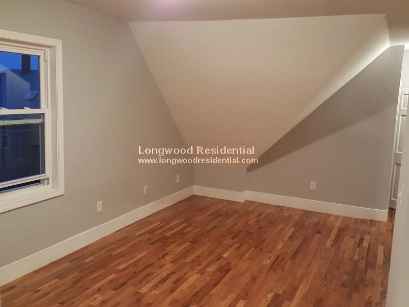 39 Pinckney Street, Unit 3 Somerville, MA 02145 - Photo 4 of 17 a view of a room with wooden floor