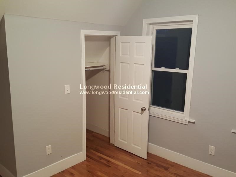 39 Pinckney Street, Unit 3 Somerville, MA 02145 - Photo 5 of 17 an empty room with wooden floor and closet