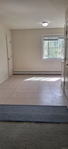 a white toilet sitting next to a bath tub