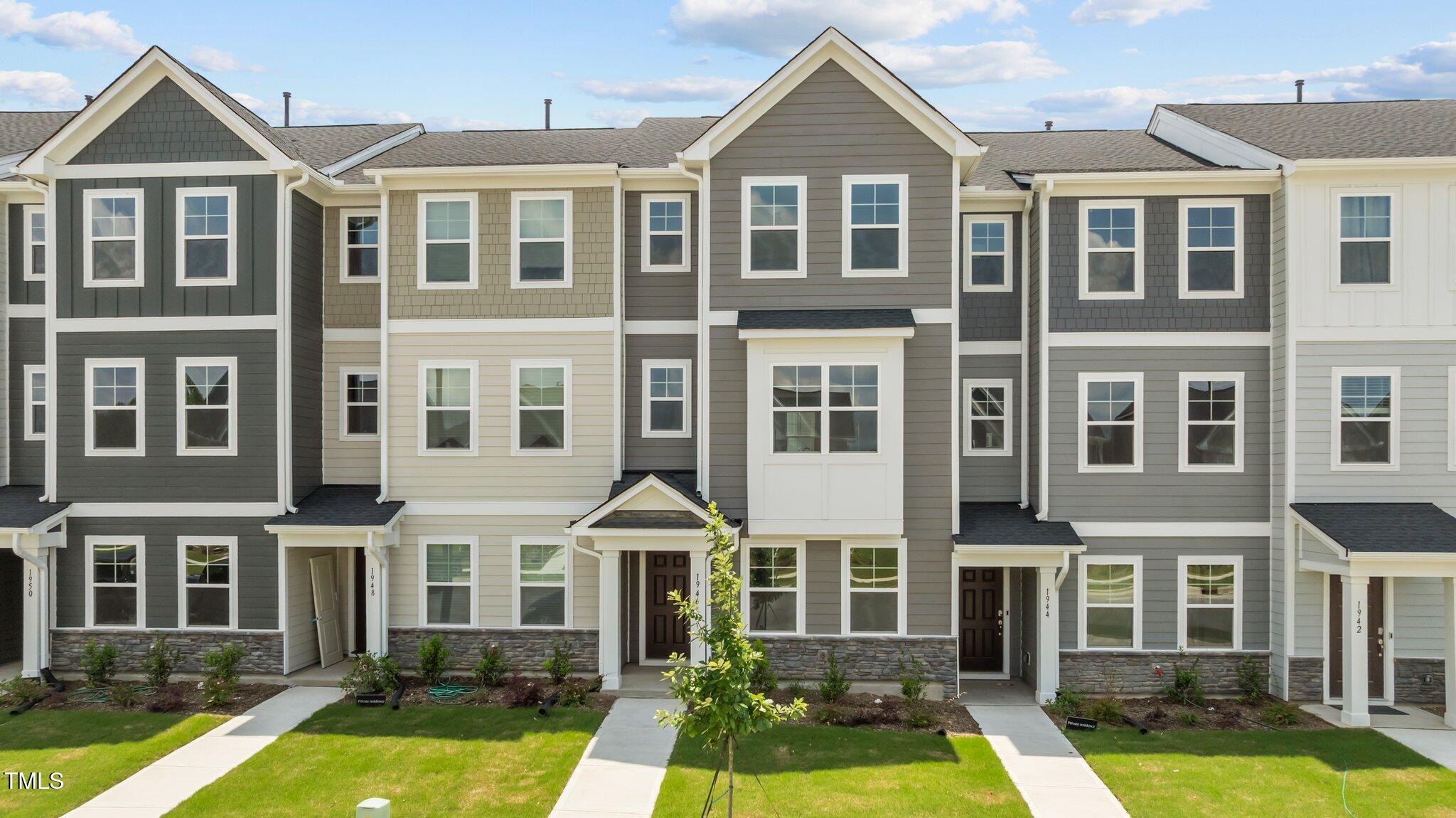 331 Devon Clfs Drive Wake Forest, NC 27587 - Photo 1 of 35 a front view of a residential apartment building with windows and pool
