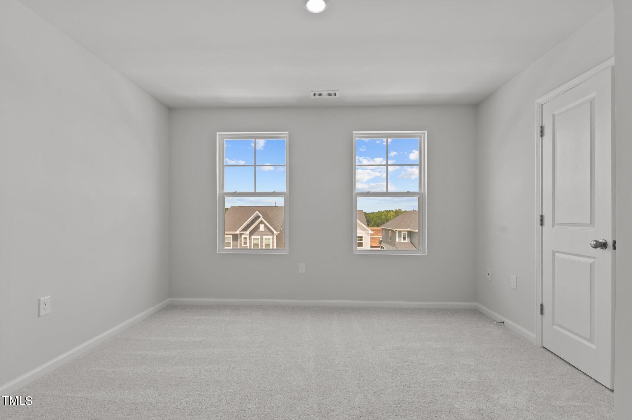 331 Devon Clfs Drive Wake Forest, NC 27587 - Photo 26 of 35 an empty room with windows