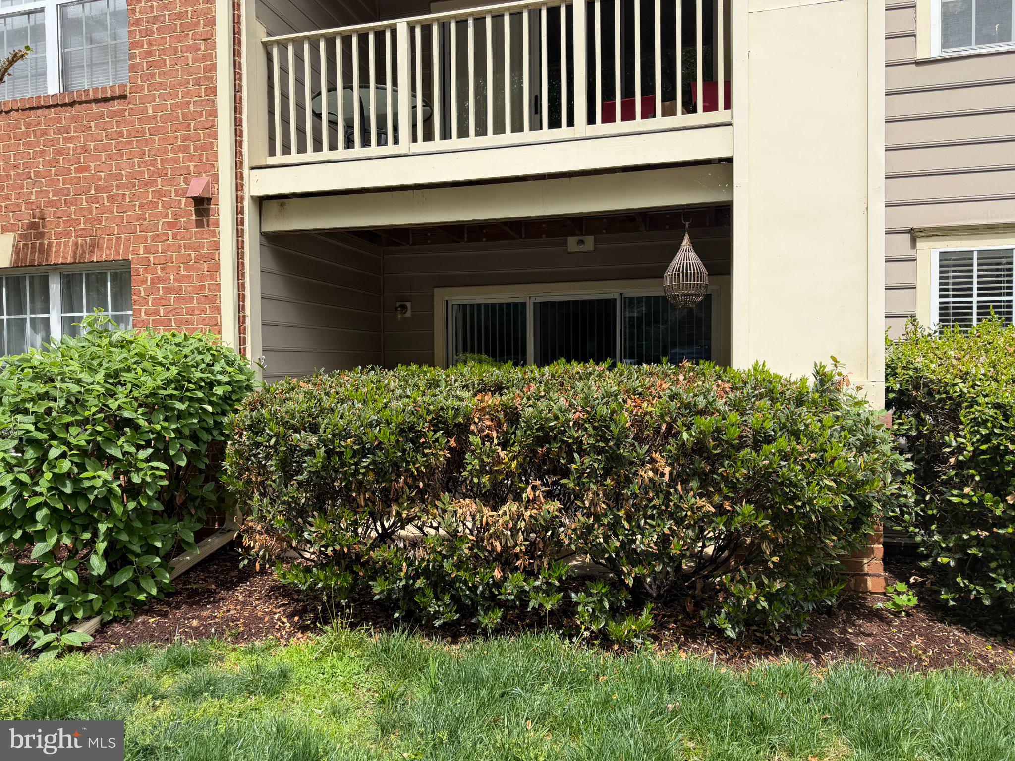 111 Timberbrook Lane, Unit 104 Gaithersburg, MD 20878 - Photo 2 of 35 Charming patio retreat with greenery.