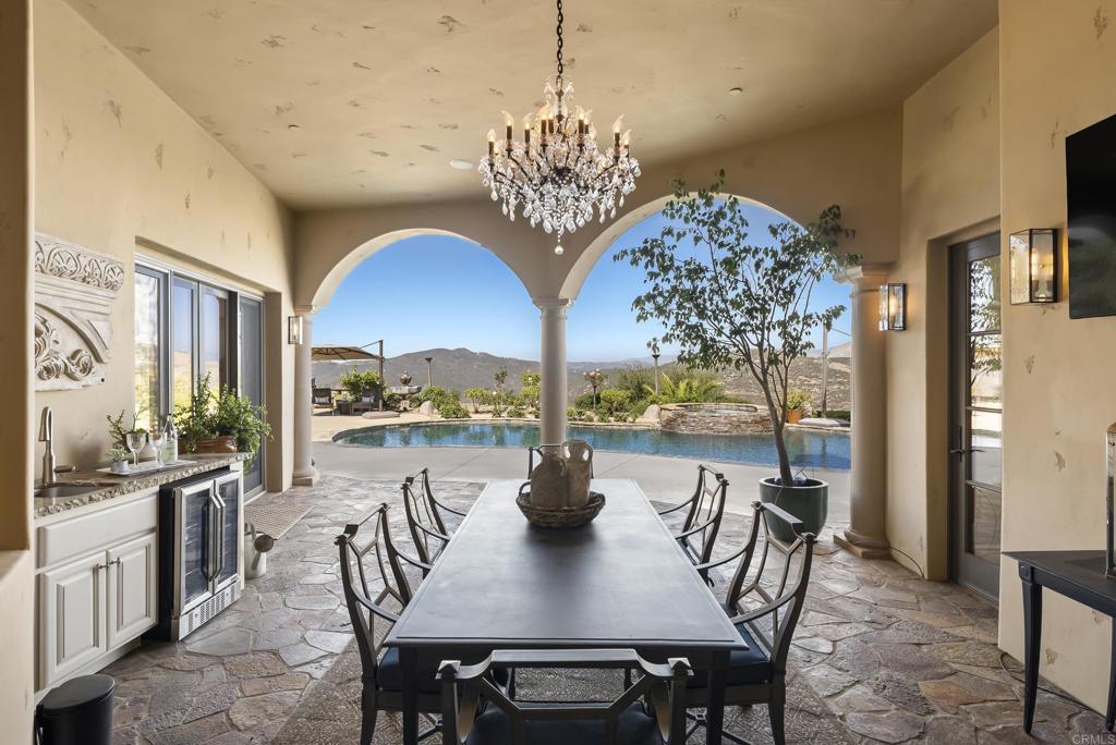 18320 Via Ambiente Rancho Santa Fe, CA 92067 - Photo 18 of 59 a view of a dining room with furniture window and outside view