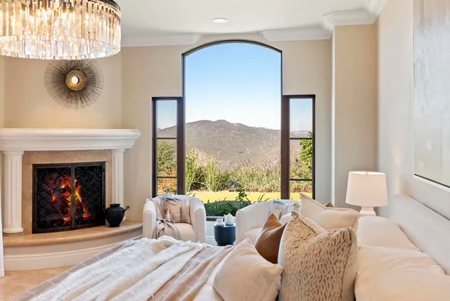 a large spacious bathroom with a granite countertop tub and a large window