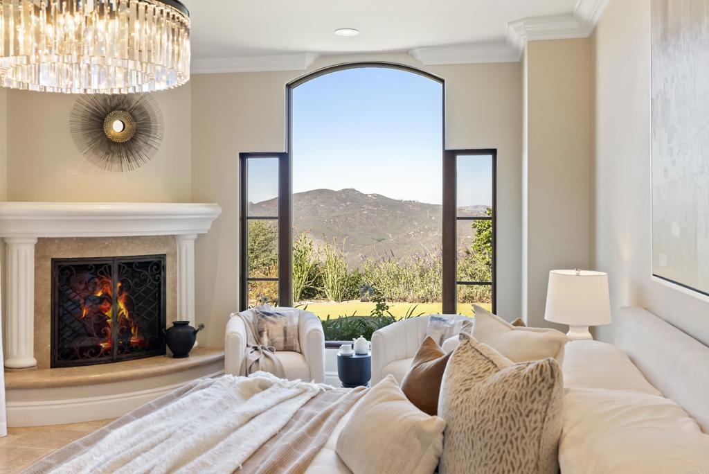 18320 Via Ambiente Rancho Santa Fe, CA 92067 - Photo 23 of 59 a living room with furniture and a fireplace