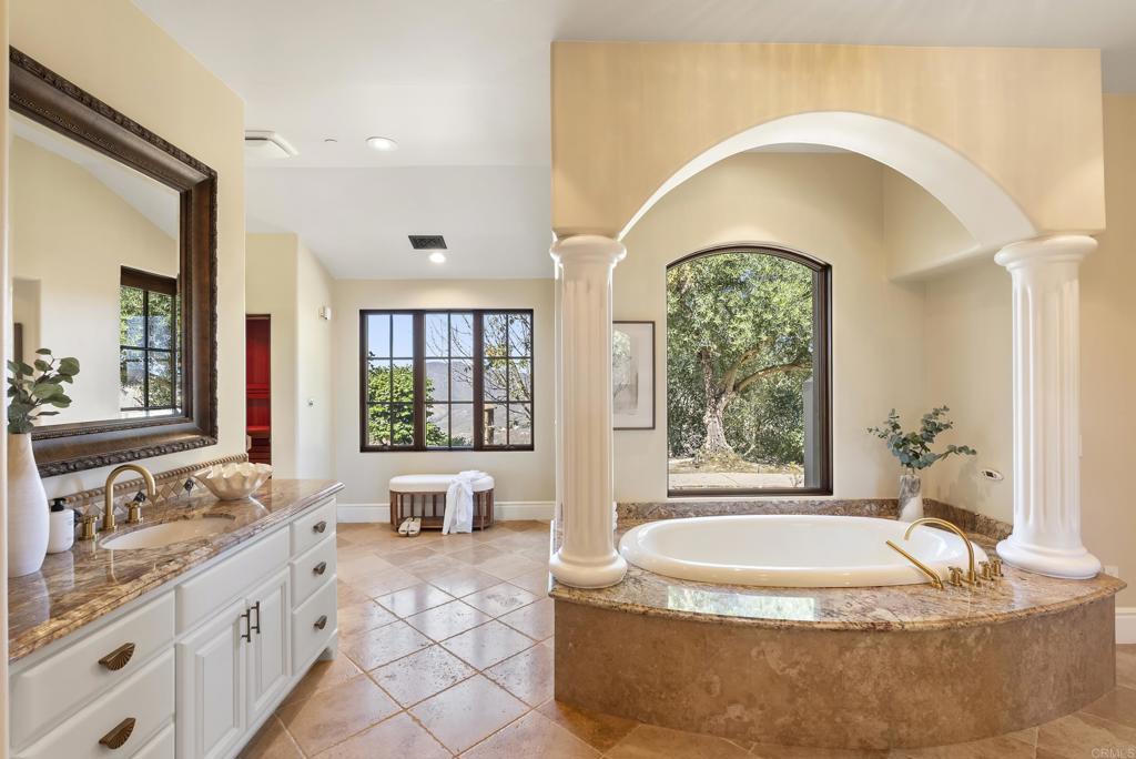 18320 Via Ambiente Rancho Santa Fe, CA 92067 - Photo 26 of 59 a spacious bathroom with a tub and a large window