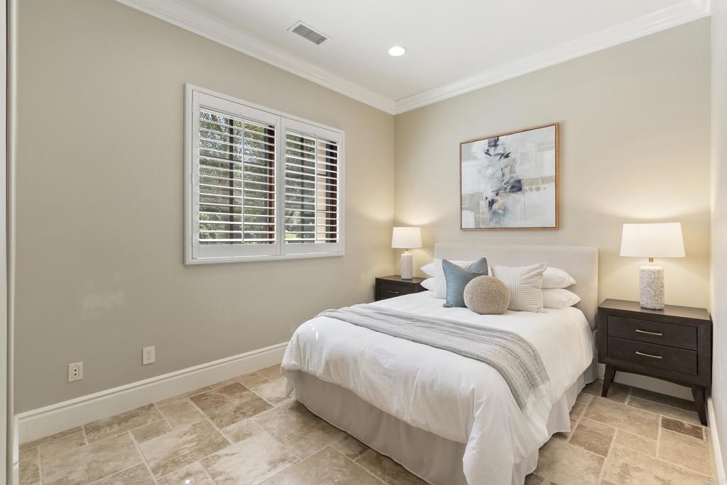 18320 Via Ambiente Rancho Santa Fe, CA 92067 - Photo 29 of 59 a bedroom with a bed and a window