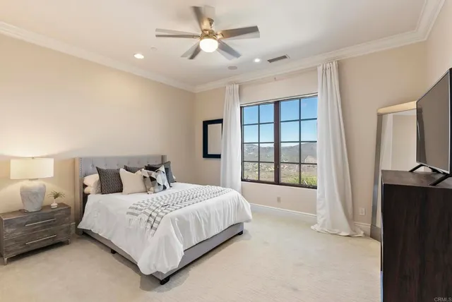 a bedroom with a bed and window