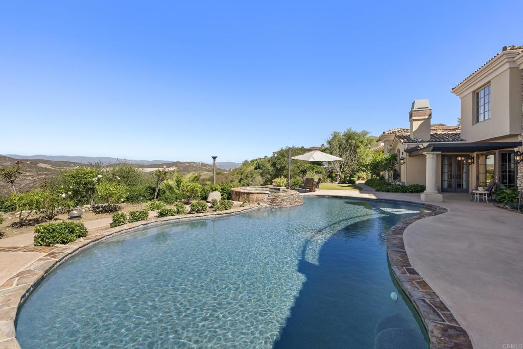 18320 Via Ambiente Rancho Santa Fe, CA 92067 - Photo 43 of 59 a view of a lake with a garden