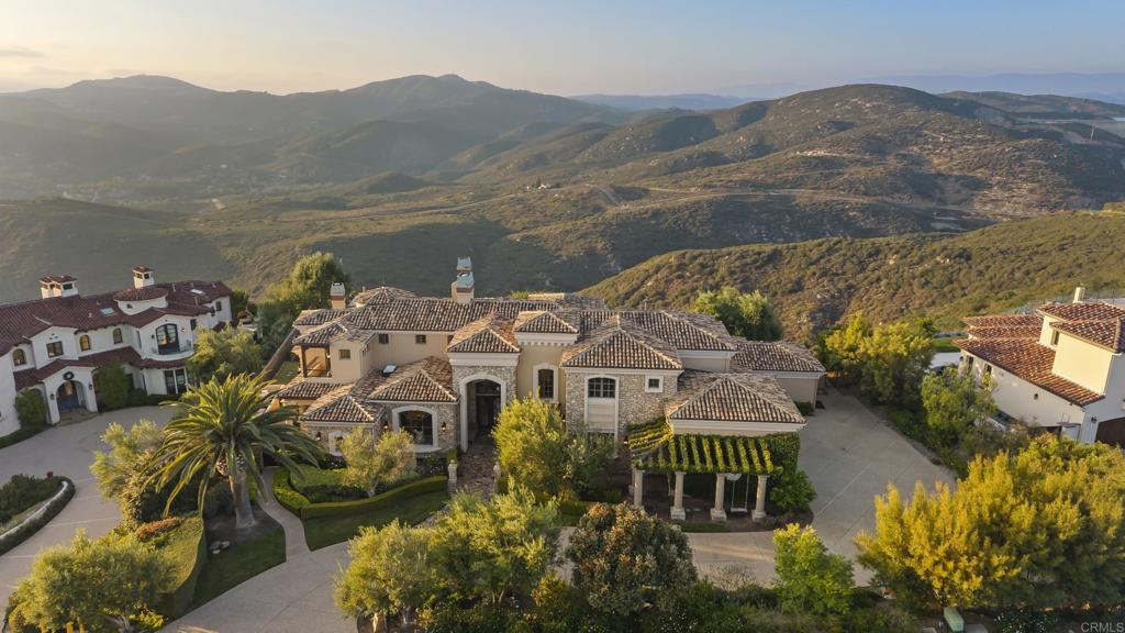 18320 Via Ambiente Rancho Santa Fe, CA 92067 - Photo 5 of 59 a view of a lake with a mountain in the background