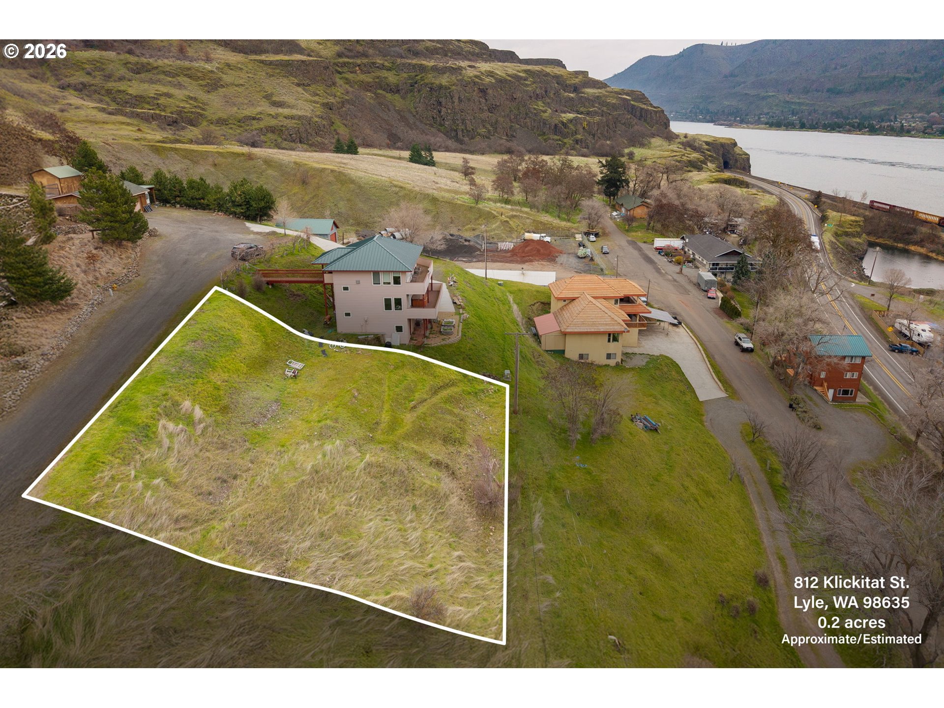 812 Klickitat Street Lyle, WA 98635 - Photo 2 of 13 a view of a swimming pool with a lake view