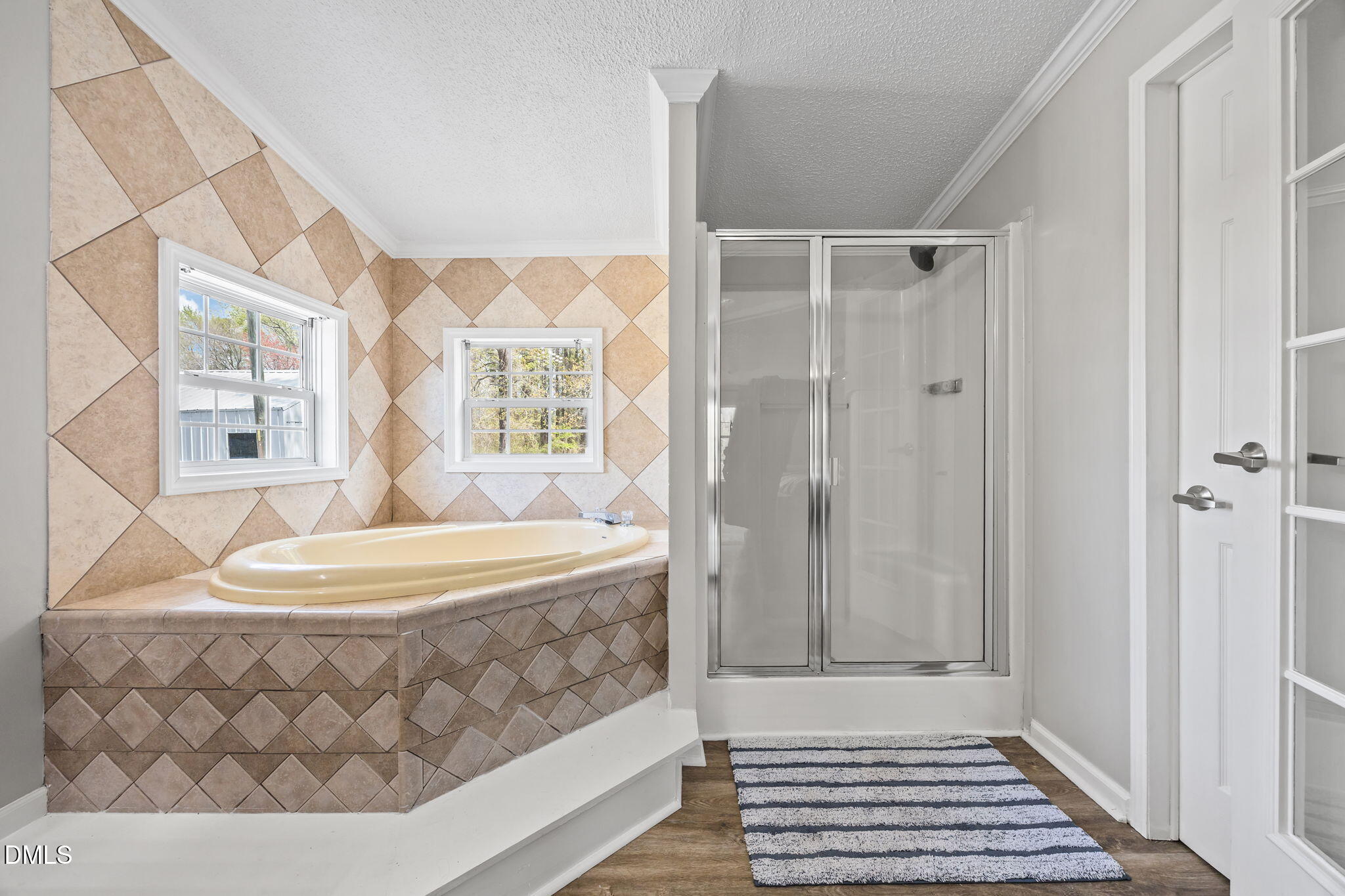 1659 Adcock Road Lillington, NC 27546 - Photo 15 of 34 a bathroom with a bathtub and a shower