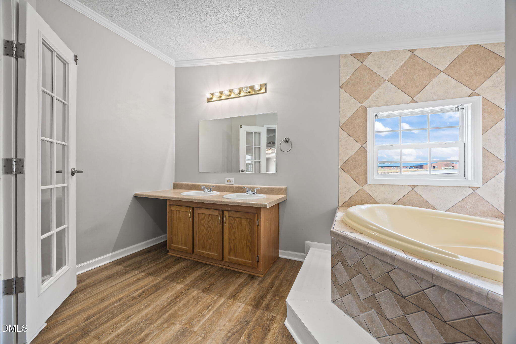 1659 Adcock Road Lillington, NC 27546 - Photo 16 of 34 a bathroom with a sink and a mirror