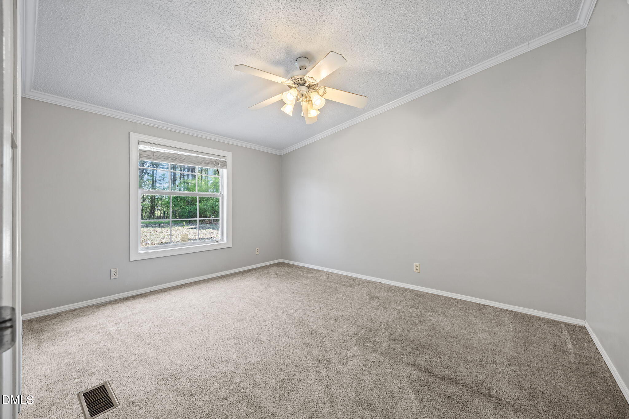 1659 Adcock Road Lillington, NC 27546 - Photo 17 of 34 an empty room with a window and a fan