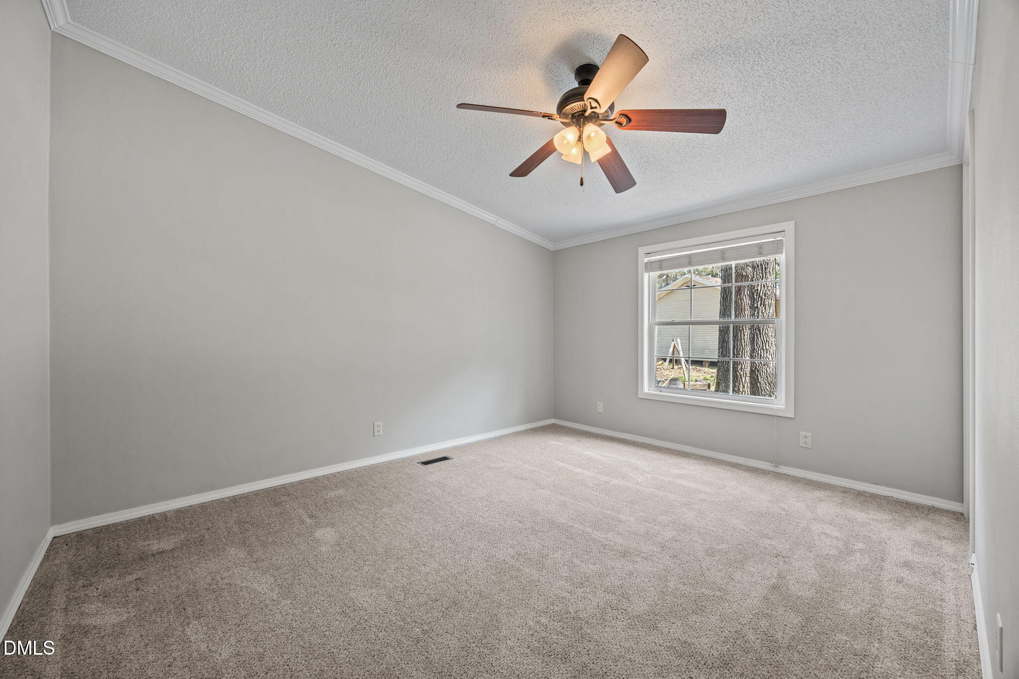 1659 Adcock Road Lillington, NC 27546 - Photo 19 of 34 an empty room with windows and fan