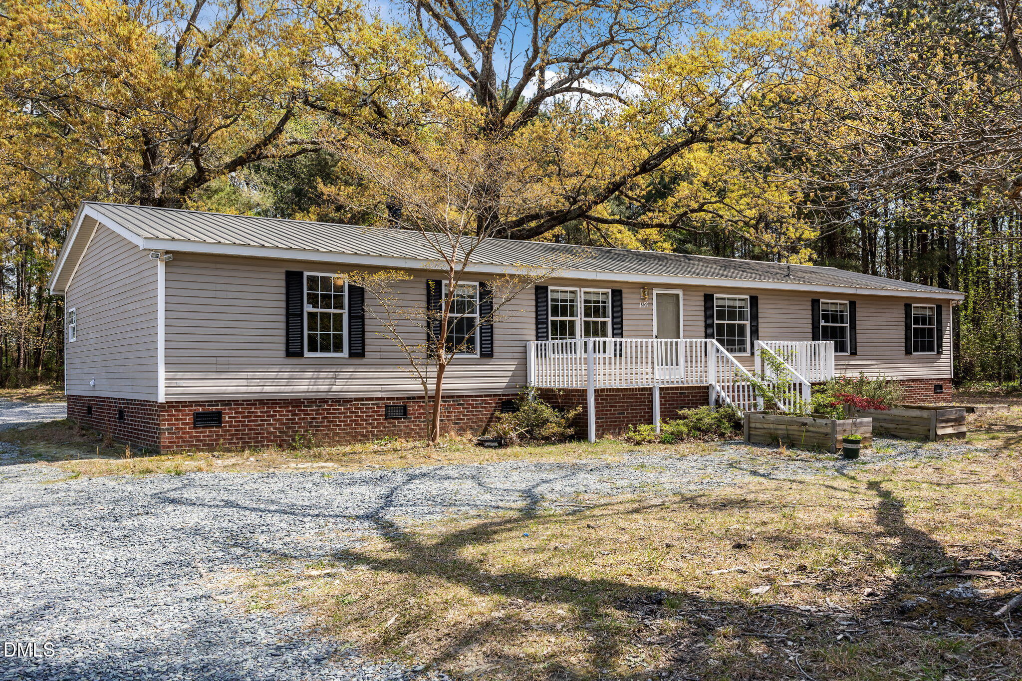 1659 Adcock Road Lillington, NC 27546 - Photo 2 of 34 a view of a house with a yard