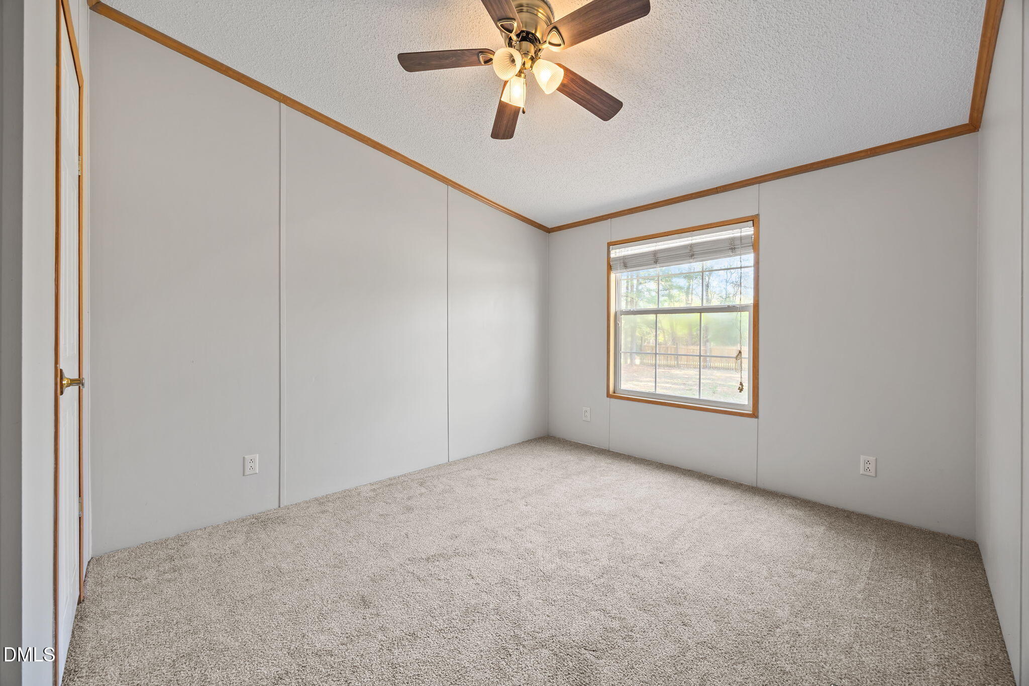 1659 Adcock Road Lillington, NC 27546 - Photo 21 of 34 an empty room with windows and fan