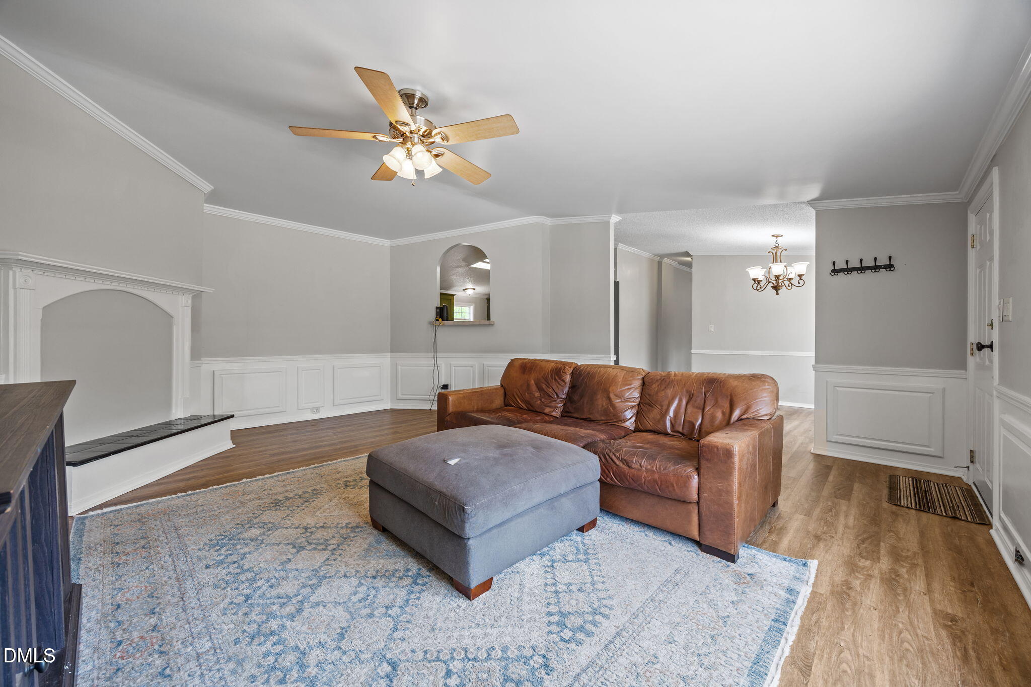 1659 Adcock Road Lillington, NC 27546 - Photo 3 of 34 a living room with a couch and chandelier
