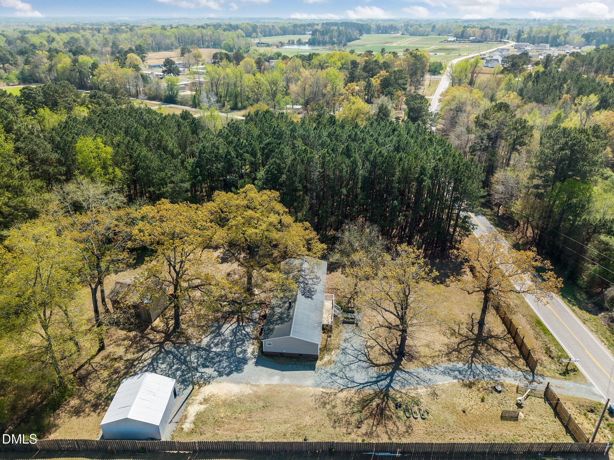 1659 Adcock Road Lillington, NC 27546 - Photo 31 of 34 a view of a yard with wooden fence