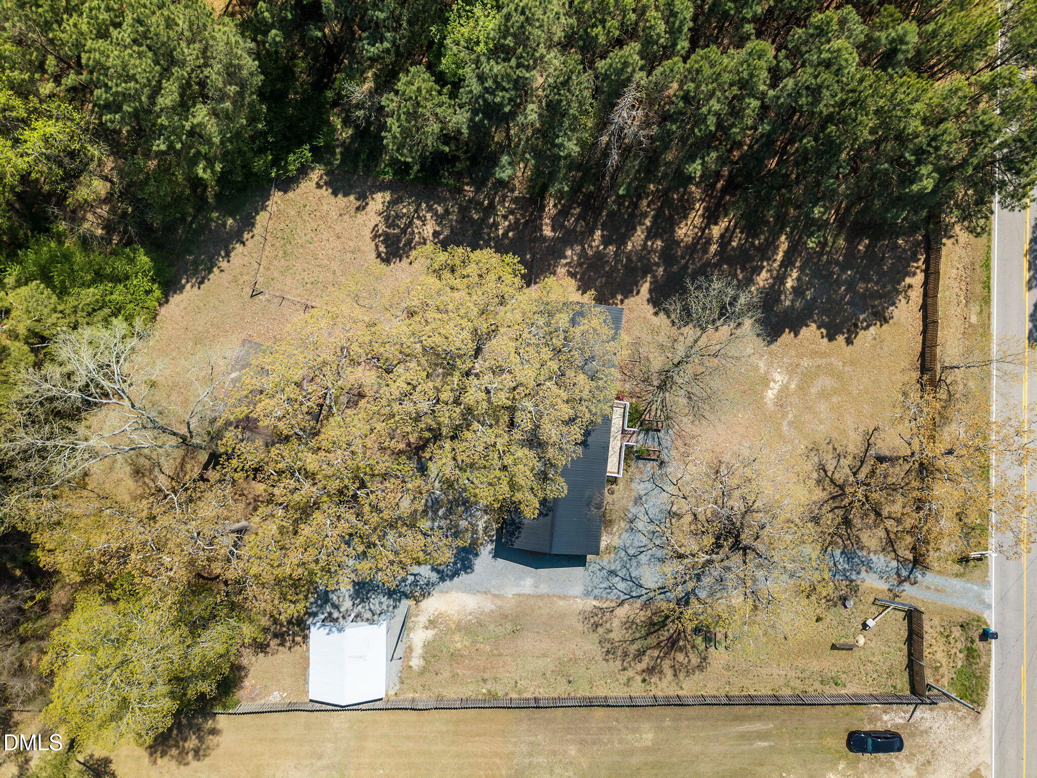 1659 Adcock Road Lillington, NC 27546 - Photo 32 of 34 a view of a yard with wooden fence