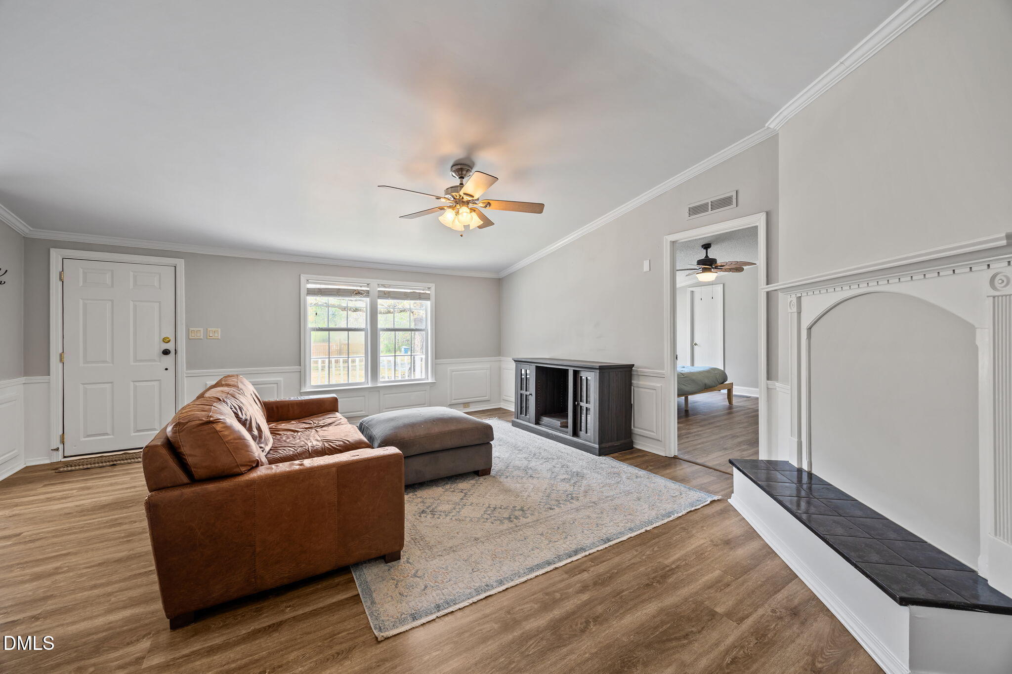 1659 Adcock Road Lillington, NC 27546 - Photo 4 of 34 a living room with furniture and a flat screen tv